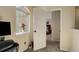 A hallway with a window and doorway to another bedroom at 18605 E Saratoga Pl, Aurora, CO 80015