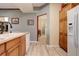 Bright kitchen featuring modern appliances, wood cabinets, and a view into the entry at 18605 E Saratoga Pl, Aurora, CO 80015