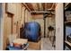 Laundry area featuring a modern blue washing machine and storage solutions at 18605 E Saratoga Pl, Aurora, CO 80015