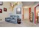 Inviting living room with comfortable seating, a staircase, and views into the hallway and kitchen at 18605 E Saratoga Pl, Aurora, CO 80015