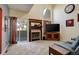 Spacious living room featuring a fireplace, large windows with a sliding door, and comfortable seating at 18605 E Saratoga Pl, Aurora, CO 80015