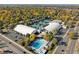 Aerial photo of a recreation center with tennis courts, an outdoor pool, and ample parking at 2602 S Kearney St, Denver, CO 80222