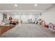 Spacious basement featuring gray carpet and white walls, offering a versatile space at 2602 S Kearney St, Denver, CO 80222