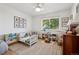 Bright bedroom featuring hardwood floors, a daybed, and natural light from a window at 2602 S Kearney St, Denver, CO 80222