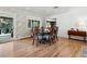 Elegant dining room with hardwood floors, decorative wallpaper, and a traditional dining set at 2602 S Kearney St, Denver, CO 80222