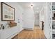 Entryway of home features hardwood floors, white walls, and modern decor at 2602 S Kearney St, Denver, CO 80222