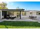 Stylish patio with comfortable seating, a dining area, and a well-manicured lawn for outdoor enjoyment at 2602 S Kearney St, Denver, CO 80222