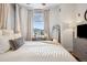 Bedroom with a comfortable bed, floor-to-ceiling window with great views, and a dresser at 444 17Th St # 807, Denver, CO 80202