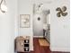 Hallway view into a kitchen featuring stylish decor and rich hardwood flooring at 444 17Th St # 807, Denver, CO 80202