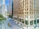 Street-level view of an elegant brick and concrete building in an urban neighborhood with a view of adjacent buildings at 444 17Th St # 807, Denver, CO 80202