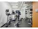 Well-equipped fitness center with multiple cardio machines and ample lighting at 444 17Th St # 807, Denver, CO 80202