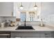 Bright kitchen with a modern sink, subway tile backsplash, and stylish light fixtures at 444 17Th St # 807, Denver, CO 80202