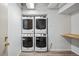 Shared laundry room area featuring stacked washer and dryer units for tenant use at 444 17Th St # 807, Denver, CO 80202