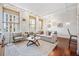 Bright, modern living room with hardwood floors, large windows, and neutral decor at 444 17Th St # 807, Denver, CO 80202