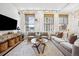 Cozy living room with large windows, stylish furnishings, and a view of the city at 444 17Th St # 807, Denver, CO 80202