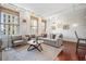 Bright, modern living room with hardwood floors, large windows, and neutral decor at 444 17Th St # 807, Denver, CO 80202