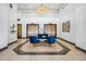 Elegant lobby with ornate elevator doors, blue seating, and tiled flooring at 444 17Th St # 807, Denver, CO 80202