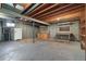 Unfinished basement with concrete walls and floors, offering potential for customization at 10636 Ura Ln, Northglenn, CO 80234