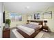 Tastefully decorated bedroom with a comfortable bed and coordinating decor at 10636 Ura Ln, Northglenn, CO 80234
