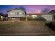 Charming two-story home boasts green shutters, brick accents, and mature landscaping in a tranquil neighborhood at 10636 Ura Ln, Northglenn, CO 80234