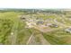 Wide aerial view of the town and surrounding properties on a large lot, showcasing its serene location and accessibility at 196 W 8Th Ave, Byers, CO 80103