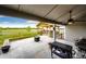 Relaxing back patio with grilling area and gazebo overlooks serene green space, perfect for outdoor entertainment at 196 W 8Th Ave, Byers, CO 80103
