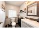Stylish bathroom featuring a vanity, toilet, and decorative accents, creating a comfortable and inviting space at 196 W 8Th Ave, Byers, CO 80103
