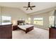 Bright bedroom featuring a large window and wood furniture at 196 W 8Th Ave, Byers, CO 80103