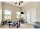 Bright bedroom featuring multiple windows, a pilates machine, and neutral colors at 196 W 8Th Ave, Byers, CO 80103