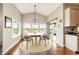 Bright breakfast nook with a round table set, hardwood floors, and ample natural light at 196 W 8Th Ave, Byers, CO 80103