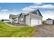 Charming home exterior with a well-manicured lawn, a three car garage, shed and appealing curb appeal at 196 W 8Th Ave, Byers, CO 80103