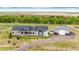 Charming ranch-style house with red shutters and a spacious workshop, nestled in a serene country setting at 196 W 8Th Ave, Byers, CO 80103