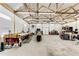 Spacious garage with work benches, high ceilings and bright lighting, perfect for projects and storage at 196 W 8Th Ave, Byers, CO 80103