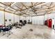 Expansive garage space featuring high ceilings, a ceiling fan, and plenty of room for activities and storage at 196 W 8Th Ave, Byers, CO 80103