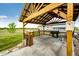 Cozy gazebo with grill and seating provides a shaded retreat with views of the surrounding landscaped yard at 196 W 8Th Ave, Byers, CO 80103