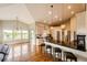 Open concept kitchen features a large island with bar seating and hardwood floors at 196 W 8Th Ave, Byers, CO 80103