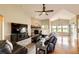 Inviting living room features a stone fireplace, large windows, and hardwood flooring at 196 W 8Th Ave, Byers, CO 80103