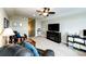 Cozy living room with fireplace, tv, and comfortable leather seating at 196 W 8Th Ave, Byers, CO 80103