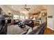 Spacious living room with a cozy fireplace, hardwood floors, and comfortable leather seating at 196 W 8Th Ave, Byers, CO 80103