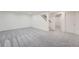 Spacious finished basement with neutral carpet, leading to the stairs and a doorway at 8463 W Arizona Dr, Lakewood, CO 80232