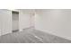 Spacious finished basement with neutral carpet and access to a closet with sliding doors at 8463 W Arizona Dr, Lakewood, CO 80232