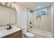 Bright bathroom with a tub, updated vanity, and modern finishes at 8463 W Arizona Dr, Lakewood, CO 80232
