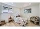 Comfortable bedroom with hardwood floors, natural light, and colorful decor at 8463 W Arizona Dr, Lakewood, CO 80232