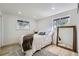 Cozy bedroom with natural light, hardwood floors, and neutral decor at 8463 W Arizona Dr, Lakewood, CO 80232