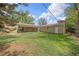 Wide view of backyard, detached garage and covered patio in home's exterior at 2921 S Holly Pl, Denver, CO 80222