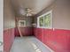 Detached garage space with two windows and grey and red walls at 2921 S Holly Pl, Denver, CO 80222