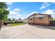 Spacious backyard featuring a concrete patio, grass, and a basketball hoop for outdoor fun and entertainment at 10949 E 109Th Pl, Northglenn, CO 80233