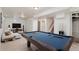 Finished basement with a pool table, comfortable seating, and a TV for entertainment at 10949 E 109Th Pl, Northglenn, CO 80233