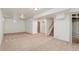 Large finished basement with stairway, ample storage space, carpet, and lighting at 10949 E 109Th Pl, Northglenn, CO 80233