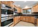 Well-lit kitchen with granite countertops, mosaic tile backsplash, and stainless steel appliances at 10949 E 109Th Pl, Northglenn, CO 80233